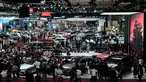 Suasana panggung mini Mercedes-Benz saat memperkenalkan AMG CLE 53 Cabriolet (merah) dalam ajang Gaikindo Indonesia International Auto Show (GIIAS) ke-32 di Indonesia Convention Exhibition (ICE), Tangerang, Banten, 23 Juli 2025. (Yasuyoshi CHIBA/AFP)