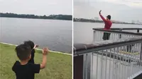 Terpisah karena Lockdown, Bapak dan Anak Saling Melambaikan Tangan dari Seberang Sungai