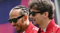 Duo pembalap Scuderia Ferrari: Lewis Hamilton dan Charles Leclerc. (Paul Crock / AFP)