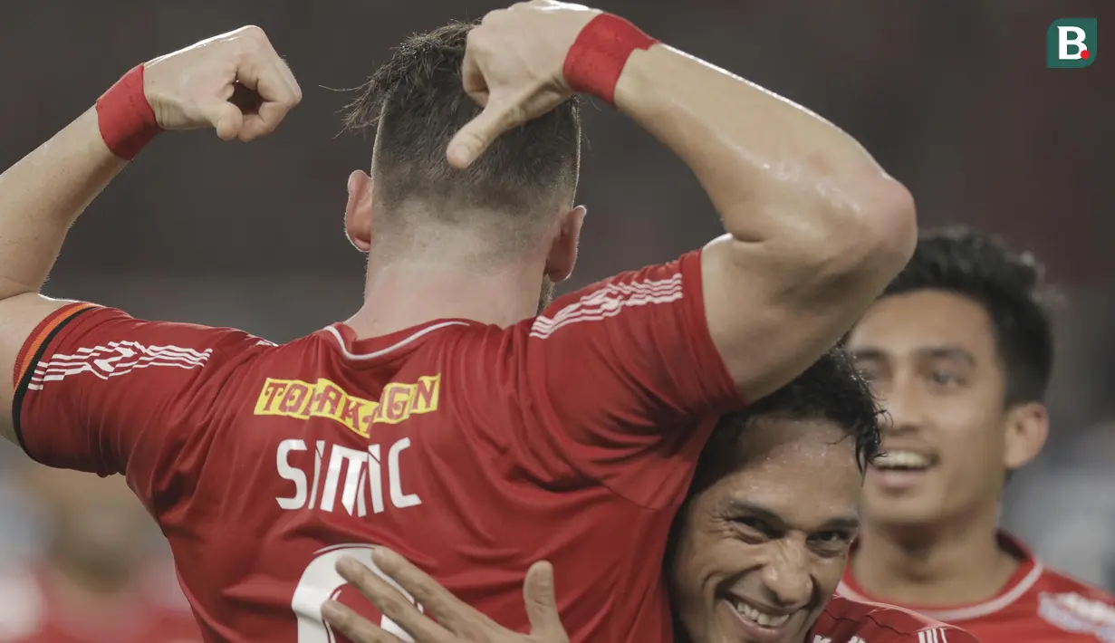 Striker Persija Jakarta, Marko Simic, melakukan selebrasi usai mencetak gol ke gawang Arema FC pada laga Liga 1 di SUGBK, Jakarta, Sabtu (31/3/2018). Babak pertama berakhir imbang 1-1. (Bola.com/M Iqbal Ichsan)