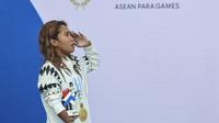 Atlet para renang Indonesia, Mutiara Cantik Harsanto, meraih medali emas ASEAN Para Games 2026 dari nomor 100m gaya dada putri SB9, di Aquatic Center 80th Anniversary Stadium, Nakhon Ratchasima, Thailand, Rabu (21/1/2026). (NPC Indonesia)