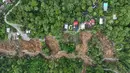 Foto udara yang diambil menggunakan drone ini menunjukkan wilayah yang terdampak longsor di Bener Meriah, Provinsi Aceh, Rabu 3 Desember 2025. Tim gabungan pemerintah daerah terus melakukan operasi pembukaan jalur darat di wilayah yang terdampak longsor di Kabupaten Bener Meriah, Provinsi Aceh. (AP Photo/Syahrul Rizal)