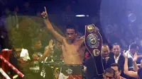 Daud Yordan pamer sabuk juara kelas ringan WBO Asia Pacific usai kalahkan Yoshitaka Kato (Johan Tallo/Liputan6.com)