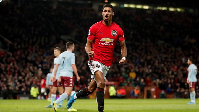 Pemain Manchester United Marcus Rashford berselebrasi setelah mencetak gol ke gawang Aston Villa pada pertandingan Liga Inggris di Old Trafford, Manchester, Inggris, Minggu (1/12/2019).  Skor berakhir 2-2. (Martin Rickett/PA via AP)