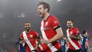 Pemain Southampton, Stuart Armstrong, melakukan selebrasi usai mencetak gol ke gawang Arsenal pada laga Liga Inggris di Stadion St Mary, Selasa (26/1/2021). Arsenal menang dengan skor 3-1. (Andy Rain/Pool via AP)