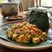 Resep Tempe Kukus Daun Pisang (image generated by AI)