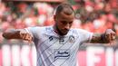 <p>Selebrasi pemain Arema FC, Gustavo Almeida Dos Santos, setelah mencetak gol ke gawang Persija Jakarta dalam pertandingan pekan kesembilan BRI Liga 1 2023/2024 yang berlangsung di Stadion Patriot Candra Bhaga, Bekasi, Minggu (20/9/2023). (Bola.com/Bagaskara Lazuardi)</p>