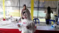 Pakai Dress Serba Putih saat Nyoblos ke TPS, Reihana: Layaknya Kanvas Kosong yang Bisa Dilukis Hal-Hal Baik