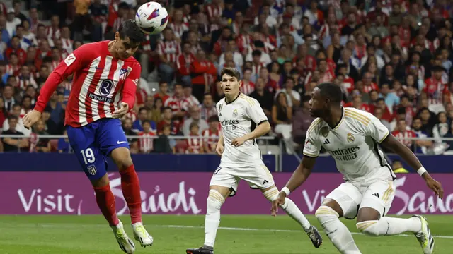Foto: Sundulan Alvaro Morata dan Antoine Griezmann Bungkam Real Madrid di El Derbi Madrileno