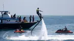 Seorang anggota Sea Doo Club Indonesia melakukan atraksi fly board yang mengibur saat peringatan HUT Kemerdekaan RI ke 71 di Kepulauan Seribu, Jakarta Utara, Rabu (17/8). (Rahmat).  