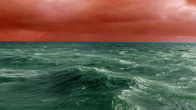 Penampaka bumi saat langit berwarna merah dan lautan berwarna hijau.