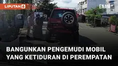 Aksi seorang pengemudi mobil tertidur di perempatan lampu merah mengundang perhatian
