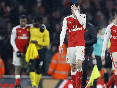 Para pemain Arsenal terlihat kecewa usai kalah dari Watord pada lanjutan Premier League di Emirates stadium, London, Selasa (31/1/2017). Arsenal kalah 1-2. (AP/Frank Augstein)