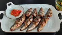 Ilustrasi ikan goreng bumbu kuning/copyrightshutterstock/J. Nina