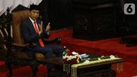 Presiden terpilih Joko Widodo  saat menghadiri pelantikan Presiden dan Wapres 2019 di Gedung MPR/DPR/DPD RI, Senayan, Jakarta, Minggu (20/10/2019). Jokowi-Ma'ruf Amin resmi dilantik sebagai Presiden dan Wapres RI periode 2019-2024. (Liputan6.com/Johan Tallo)