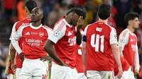 Ekspresi gelandang Arsenal Eberechi Eze (kiri) dan rekan-rekannya setelah kalah dari Paris Saint-Germain di final Liga Champions 2025/2026 di  Puskas Arena, Budapest, Minggu (31/5/2026) dini hari WIB. (Nicolas Tucat/AFP)