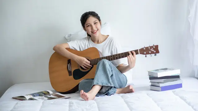 Bermain Gitar
