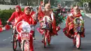Peserta mengikuti kegiatan lomba sepeda hias di sekitar Gedung Kementerian Hukum dan HAM di Jakarta, Sabtu (19/8). Lomba tersebut digelar dalam rangka memperingati hari kemerdekaan ke-72 RI. (Liputan6.com/Immanuel Antonius)