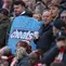 Pendukung Liverpool berdiri sebelum pertandingan Liga Inggris antara Liverpool dan Manchester City di Liverpool, Inggris, Minggu, 11 Oktober 2026. (AP Photo/Jon Super)