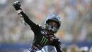 Pebalap Yamaha, Maverick Vinales, melakukan selebrasi usai menjuarai MotoGP Belanda di Sirkuit Assen, Belanda, Minggu (30/6/2019). Vinales sukses menjadi juara dengan catatan waktu 40 menit 55,415 detik. (AP//Peter Dejong)