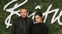 David dan Victoria Beckham di karpet merah British Fashion Awards 2014, London, Inggris. (JUSTIN TALLIS / AFP)