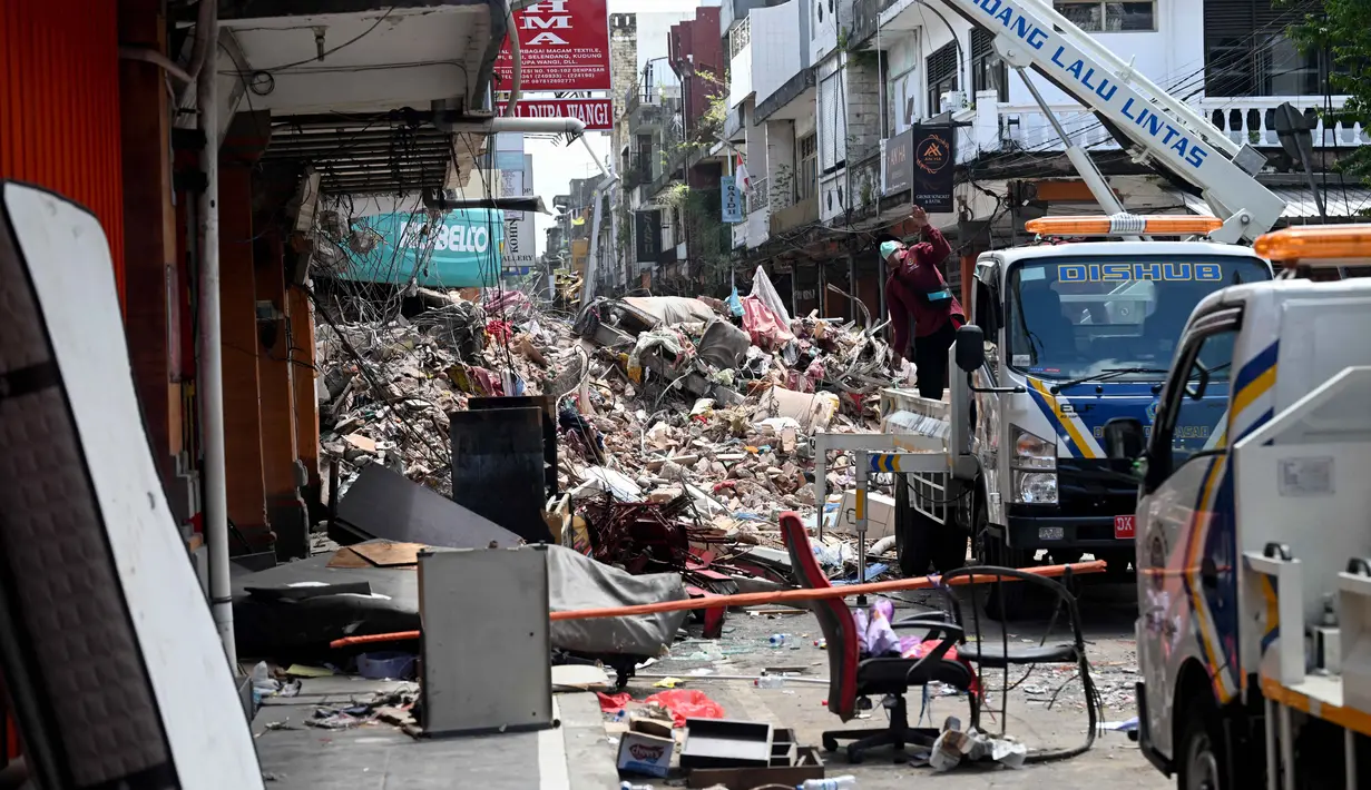 Rabu (10/9/2025), Badan Nasional Penanggulangan Bencana (BNPB) mencatat, sebanyak tujuh wilayah kabupaten/kota di Provinsi Bali terdampak bencana banjir dan longsor. (SONNY TUMBELAKA/AFP)
