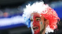 Seorang suporter Prancis memberikan dukungan menjelang pertandingan Grup I Piala Dunia 2026 antara Prancis melawan Senegal di Stadion New York/New Jersey, East Rutherford, pada 16 Juni 2026. (TIMOTHY A. CLARY / AFP)