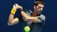 Aksi Novak Djokovic di Australia Open (PAUL CROCK / AFP)