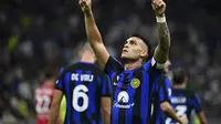 Lautaro Martinez memboyong 2 gol Inter Milan saat kalahkan Monza pada pekan pertama Liga Italia di stadion Giuseppe Meazza, Minggu 20 Agustus 2023 (AFP)