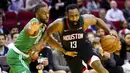 Pebasket Houston Rockets, James Harden, berusaha melewati pebasket Boston Celtics, Kemba Walker, pada laga NBA Rabu (12/2/2020). Houston Rockets menang 116-105 atas Boston Celtics. (AP/David J. Phillip)