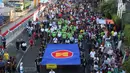 Menteri Luar Negeri Retno Marsudi dan Kemenaker Trans Hanif Dhakiri saat memimpin jalannya Parade Asean 50 Tahun di Jakarta, Minggu (27/8). Acara Parade ASEAN 50 tahun ini digelar oleh Kemlu. (Liputan6.com/Angga Yuniar)