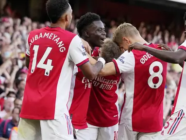 Arsenal tampil perkasa dan memenangi Derby London Utara pertama musim ini dalam lanjutan Liga Inggris 2021/2022, Minggu (26/9/2021). (AP/Frank Augstein)