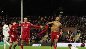 Striker Liverpool, Cody Gakpo, merayakan golnya ke gawang Fulham pada lanjutan Liga Inggris 2025/2026 di Stadion Craven Cottage, Minggu (4/1/2026) malam WIB. (Adrian Dennis / AFP)