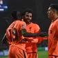 Trio penyerang Liverpool, Sadio Mane, Mohamed Salah, dan Roberto Firmino. (AFP/Francisco Leong)