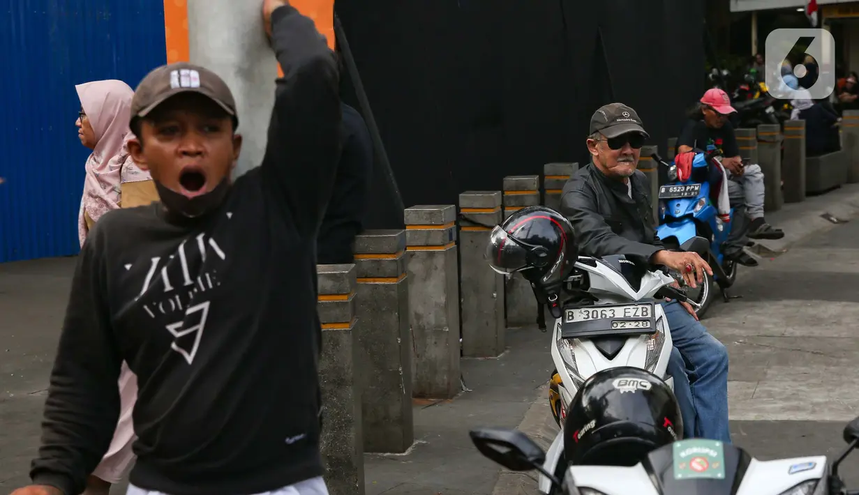 Sebelumnya, pengemudi ojek pangkalan mempertanyakan apakah mereka akan mendapatkan perlakuan yang sama seperti pengemudi ojek online atau daring. (Liputan6.com/Angga Yuniar)