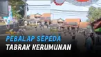 Tiba-tiba seorang pebalap keluar dari jalur dan menabrak kerumunan penonton depan warung.