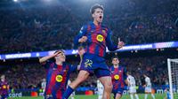 Pemain Barcelona, Marc Bernal, melakukan selebrasi setelah mencetak gol ke gawang Newcastle United pada pertandingan leg kedua babak 16 besar Liga Champions di stadion Camp Nou di Barcelona (19/3/2026). (AP Photo/Joan Monfort)