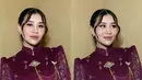 Rambut panjang kecoklatannya ditata sanggul up do. Semakin menarik dengan poni panjang belah dua membingkai wajah. [@ochiipramita]