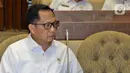 Menteri Dalam Negeri Tito Karnavian saat Rapat Kerja dengan Komisi II DPR di Kompleks Parlemen, Senayan, Jakarta, Selasa (26/2/2020). Rapat tersebut membahas berbagai isu, di antaranya Pilkada 2020 dan pengamanan kontingen PON selama berada di Papua. (Liputan6.com/Johan Tallo)