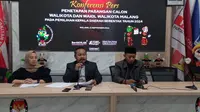 KPU Kota Malang mengumumkan&nbsp;penetapan tiga pasangan calon peserta Pilkada Kota Malang pada Minggu, 22 September 2024 malam (Liputan6.com/Zainul Arifin)&nbsp;