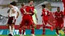 Penyerang Liverpool, Diogo Jota bersama rekan setimnya Fabinho merayakan gol ke gawang Arsenal pada pekan ketiga Liga Inggris di Anfield, Selasa dinihari WIB (29/9/2020). Tertinggal lebih dulu, Liverpool mampu membungkam Arsenal dengan skor 3-1. (Jason Cairnduff/Pool via AP)
