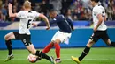 Prancis tetap sabar untuk berusaha membongkar pertahanan Austria. Hasilnya pun baru didapat pada menit ke-56 kala Mbappe sukses mencetak gol pemecah kebuntuan. (AFP/Franck Fife)