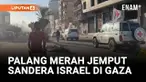 Kendaraan Palang Merah terlihat melintasi Jalur Gaza untuk menjemput tujuh sandera Israel yang dibebaskan oleh Hamas. Pembebasan ini menjadi tahap awal dari kesepakatan gencatan senjata yang mengakhiri dua tahun perang antara Israel dan Hamas.