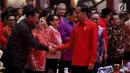 Presiden Joko Widodo atau Jokowi saat menghadiri HUT ke-46 PDIP di JIExpo Kemayoran, Jakarta, Kamis (10/1). Jokowi berpesan kepada para kader PDIP untuk bergotong royong memperkuat persatuan Indonesia. (Liputan6.com/JohanTallo)