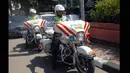 Polwan mengendarai motor besar melintasi kawasan Bundaran HI, Jakarta, Rabu (18/3/2015). Polda Metro Jaya kekurangan sepeda motor voorijder untuk pelayanan publik dan operasional mengatasi kemacetan. (Liputan6.com/Faizal Fanani)