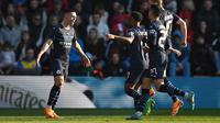 Pemain Manchester City merayakan gol yang dicetak Phil Foden dalam laga kontra Southampton di perempat final Piala FA, Minggu (20/3/2022). Man City menang 4-1 untuk lolos ke semifinal Piala FA. (GLYN KIRK / AFP)