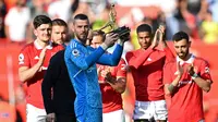 Kiper Manchester United David de Gea memenangkan trofi Sarung Tangan Emas setelah membuat clean sheet terbanyak di Liga Inggris musim 2022/2024. (foto:&nbsp;Paul ELLIS / AFP)