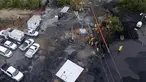 Pemandangan udara menunjukkan lokasi di mana petugas penyelamat berusaha menjangkau 10 penambang yang terjebak di tambang batu bara yang terendam banjir sejak 3 Agustus, di komunitas Agujita, Kota Sabinas, Negara Bagian Coahuila, Meksiko (15/8/2022). Otoritas Meksiko mengumumkan Senin rencana untuk menutup kebocoran ke tambang batu bara di mana 10 pekerja telah terperangkap selama lebih dari seminggu, setelah banjir baru memberikan kemunduran besar bagi upaya penyelamatan. (AFP/Pedro Pardo)