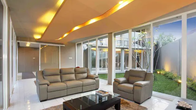 Desain Rumah Modern dengan Permainan Warna Orange dan Hijau