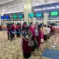 Jemaah Umrah memadati imigrasi Bandara Soekarno-Hatta Tangerang. (Liputan6.com/Pramita Tristiawati)